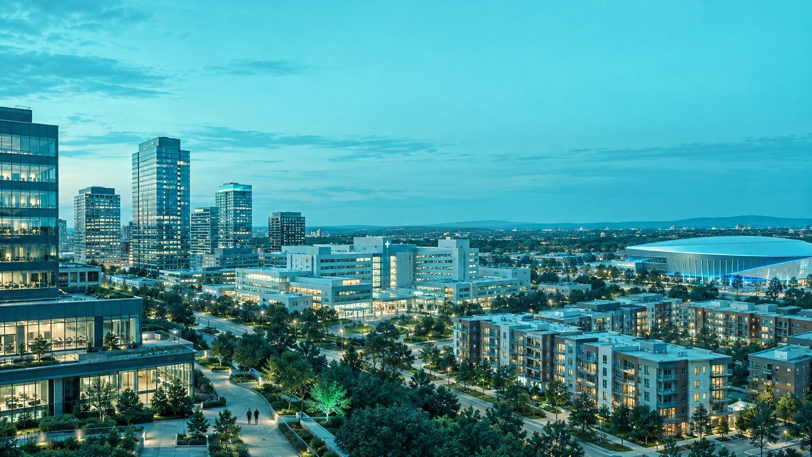 Wide view of a varied institutional real estate portfolio at blue hour